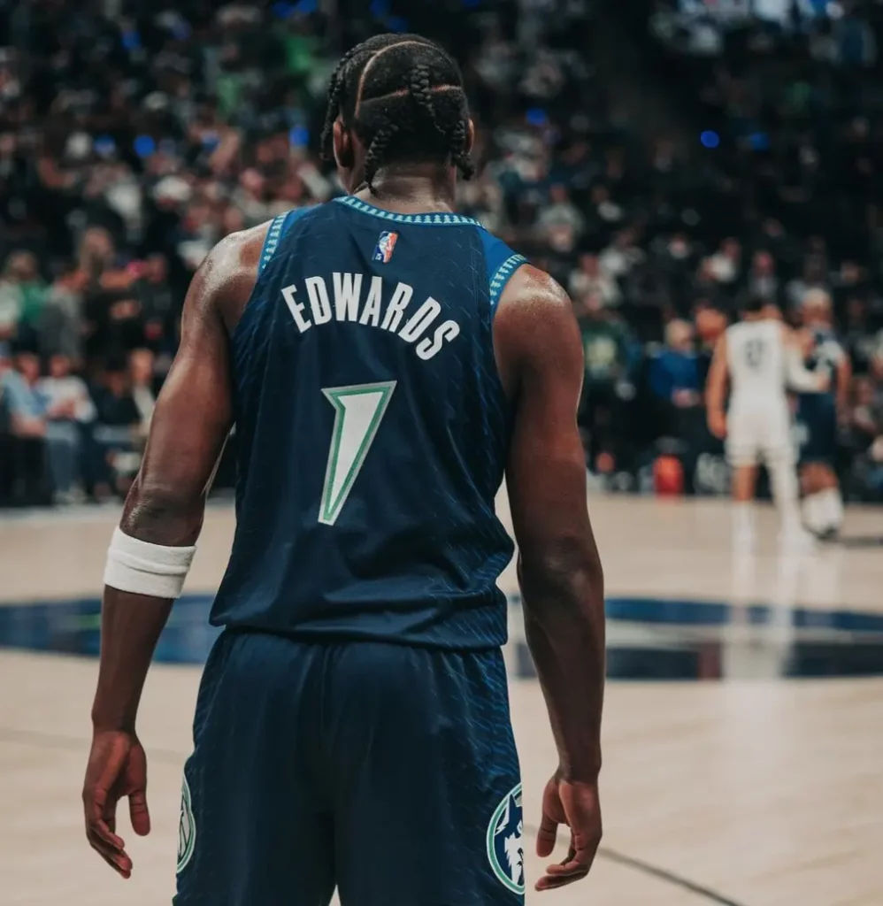 Back-facing picture of Minnesota Timberwolves guard Anthony Edwards showing his name and number on his jersey as he surveys the court